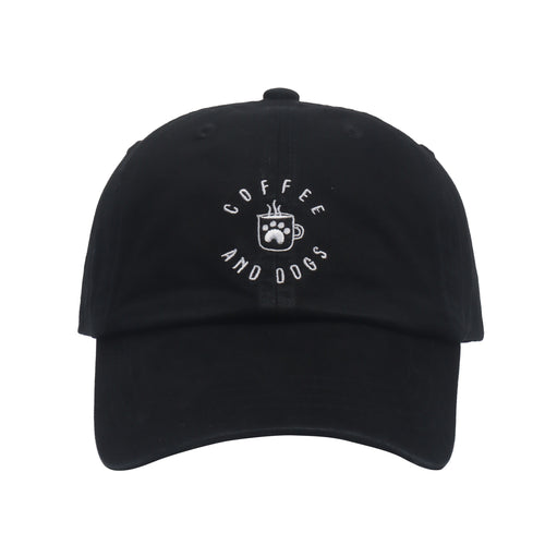 May include: A black baseball cap with a white embroidered design that says 'Coffee and Dogs' with a coffee cup and paw print in the center.